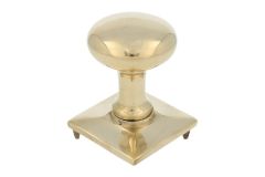 Round door Knob on square rosette polished brass