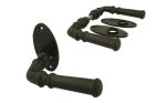 Black cast iron classic doorhandles on oval rosette