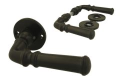 Black cast iron classic doorhandles on round rosette