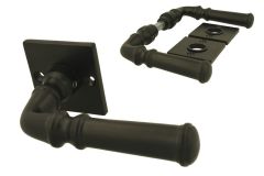 Black cast iron classic doorhandles on square rosette