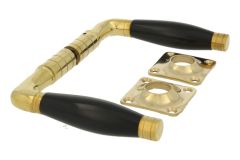 Door handles polished brass bakelite pair (1926) + rosettes