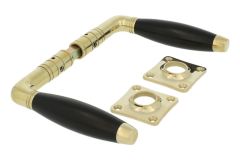 Door handles polished brass ebony pair (1931) with rosettes