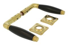 Door handles polished brass ebony pair (1929) with rosettes