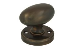 Turnable oval door knob antique brass with round rosette